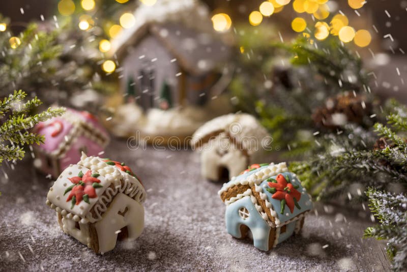 Gingerbread house on the background of a Christmas tree stock photo Gingerbread house on the background of a Christmas tree stock photo