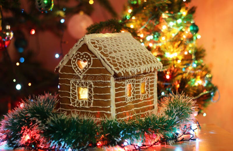 Gingerbread House with Icing. Festive Evening Tree with Lights and ...