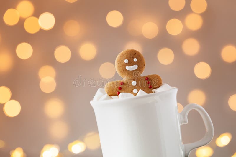 Gingerbread man in cup of hot cocoa with marshmallow. Christmas cookie stock images