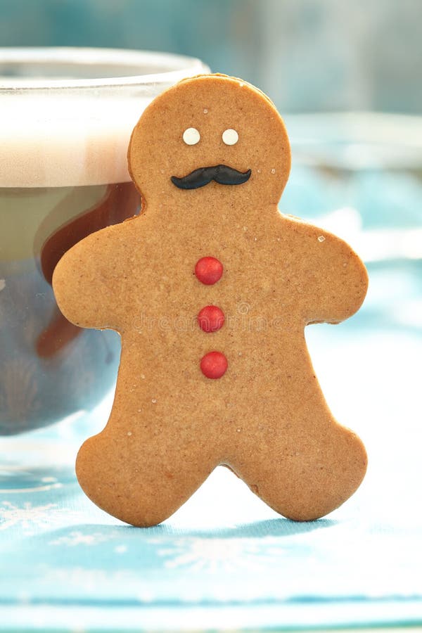 Gingerbread man in hot chocolate royalty free stock photos