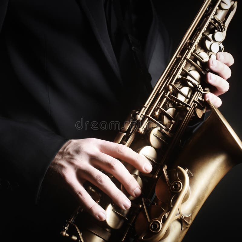 Saxophone alto jazz music instruments in hands Sax close up. Saxophone alto jazz music instruments in hands Sax close up