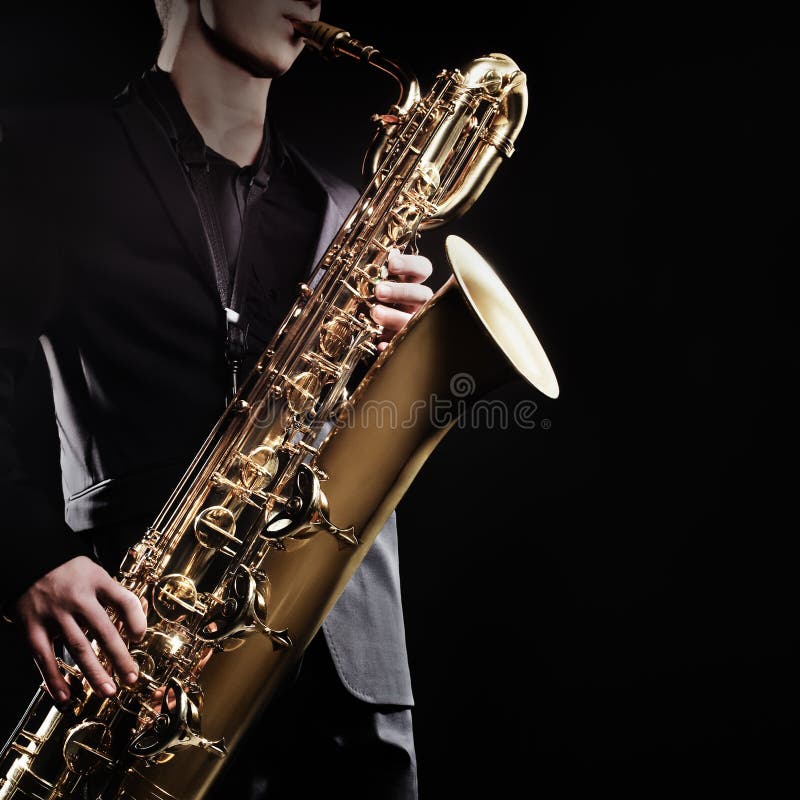 Saxophone baritone jazz music instruments isolated on black Sax close up. Saxophone baritone jazz music instruments isolated on black Sax close up