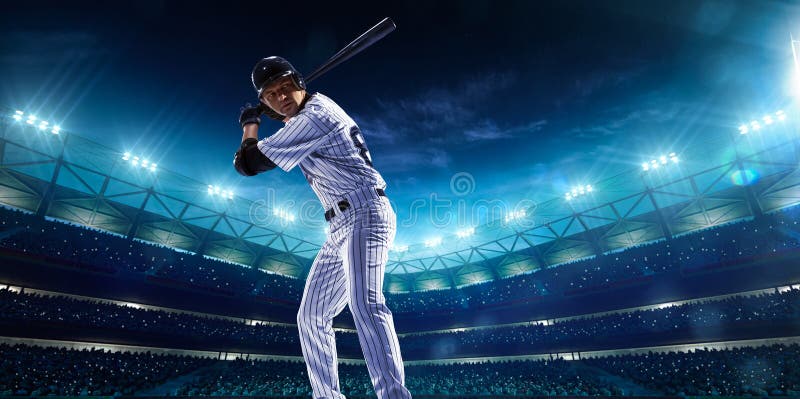Giocatori di baseball professionisti sulla grande arena di notte fotografia stock Giocatori di baseball professionisti sulla grande arena di notte fotografia stock
