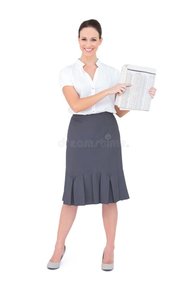 Giornale di classe felice della tenuta della donna di affari fotografia stock Giornale di classe felice della tenuta della donna di affari fotografia stock