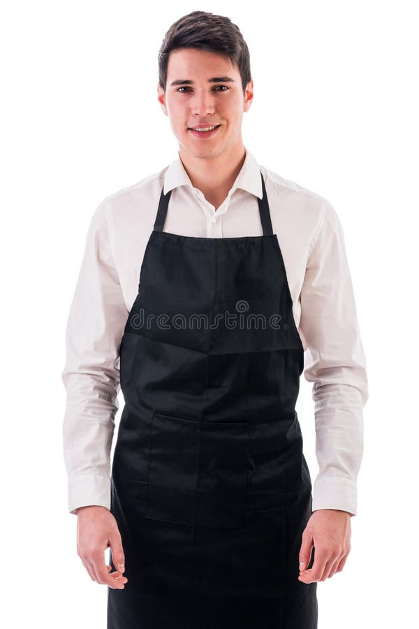 Giovane cuoco unico o cameriere che indossa grembiule nero isolato