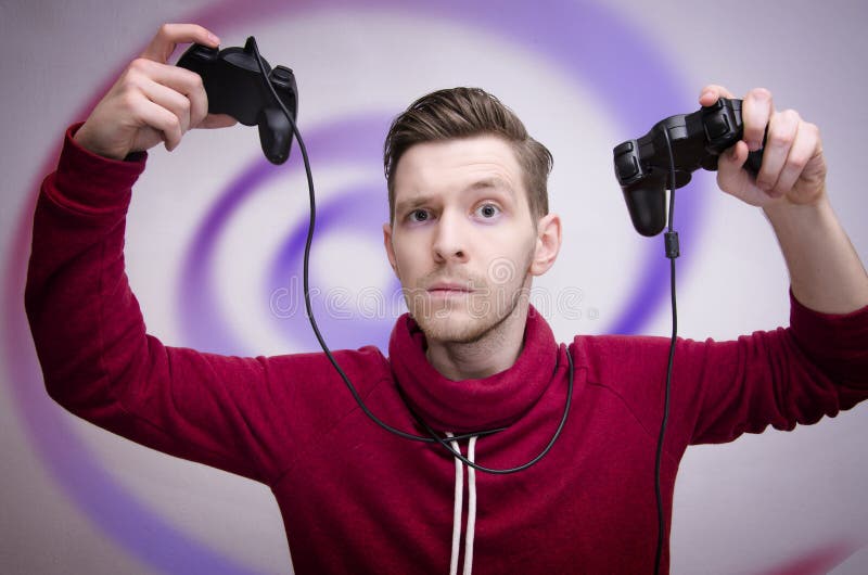 Young man addicted to video games concept, with hypnotizing spiral in background. Young man addicted to video games concept, with hypnotizing spiral in background