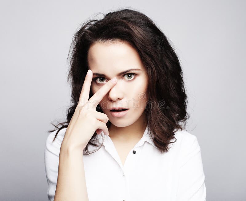 Lovely woman showing victory or peace sign. Lovely woman showing victory or peace sign