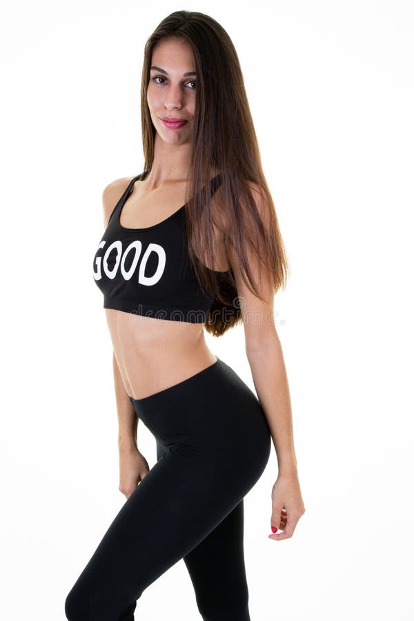 Giovane donna caucasica di forma fisica nel corpo di misura degli abiti sportivi del nero della ragazza su fondo bianco fotografia stock Giovane donna caucasica di forma fisica nel corpo di misura degli abiti sportivi del nero della ragazza su fondo bianco fotografia stock