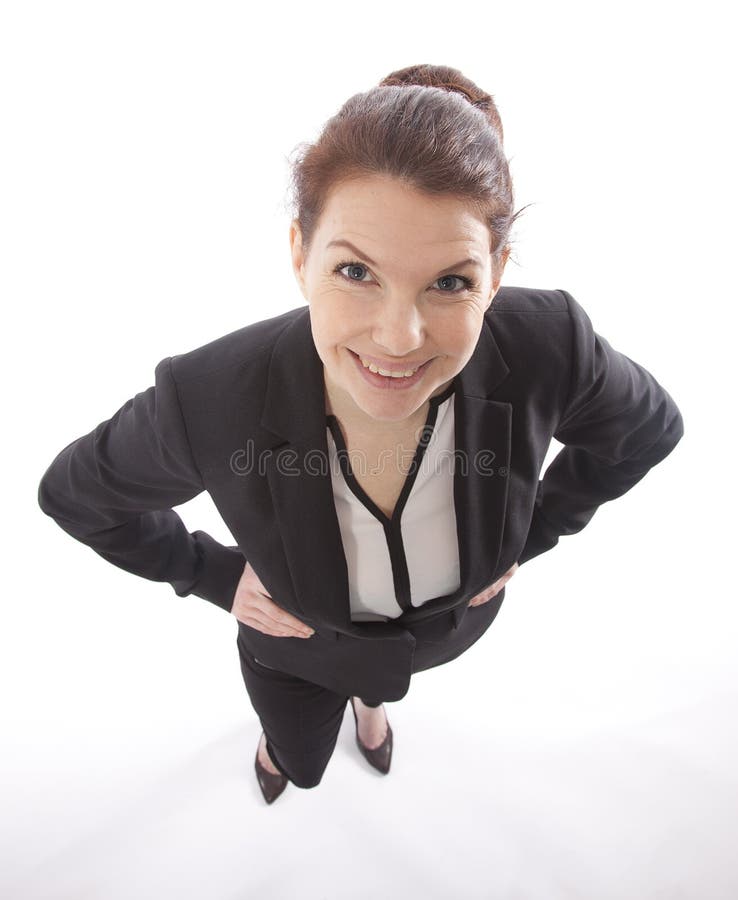 Giovane donna di affari che cerca da sopra isolato fotografia stock Giovane donna di affari che cerca da sopra isolato fotografia stock