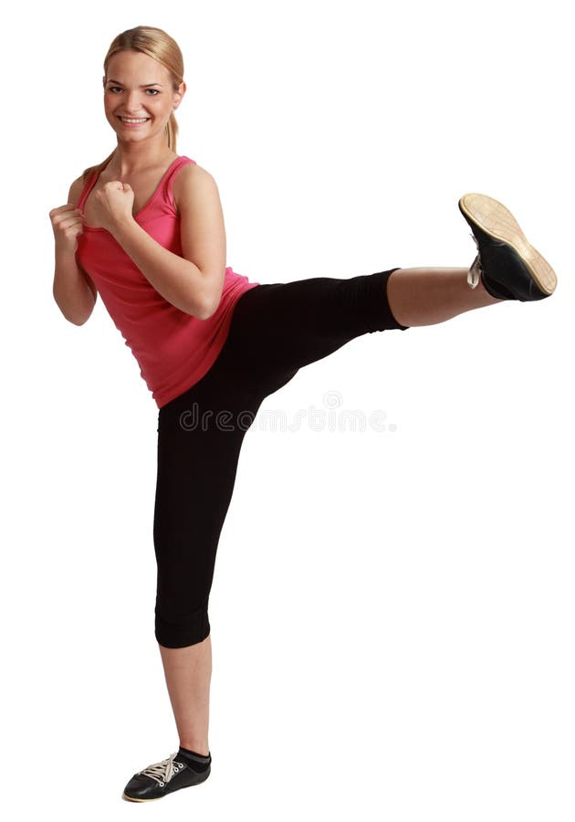 Giovane kickboxing della donna di Bonde fotografia stock Giovane kickboxing della donna di Bonde fotografia stock