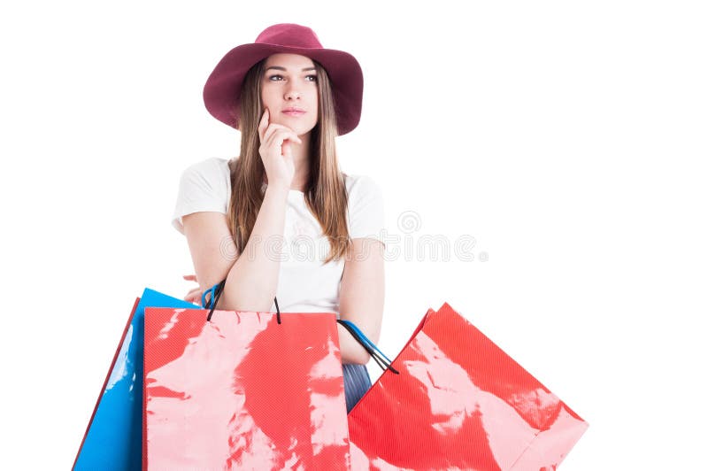 Giovane modello serio ad acquisto che sembra pensieroso fotografia stock Giovane modello serio ad acquisto che sembra pensieroso fotografia stock