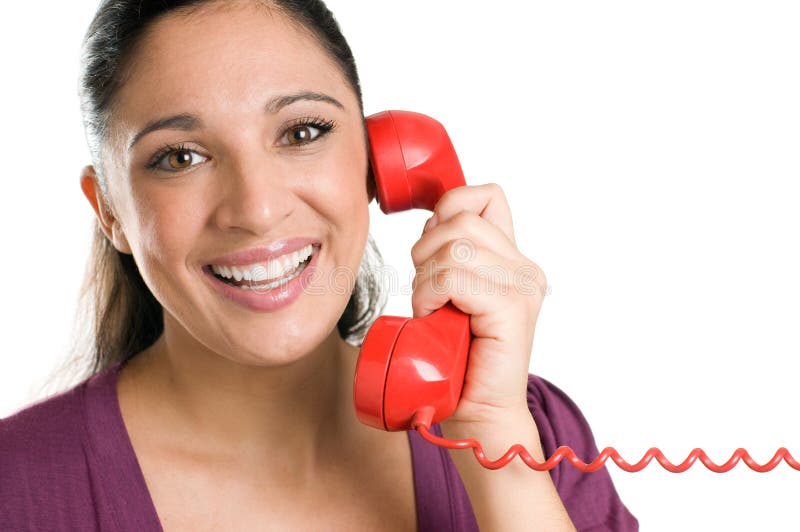 Giovane operatore sorridente con il telefono rosso fotografia stock Giovane operatore sorridente con il telefono rosso fotografia stock