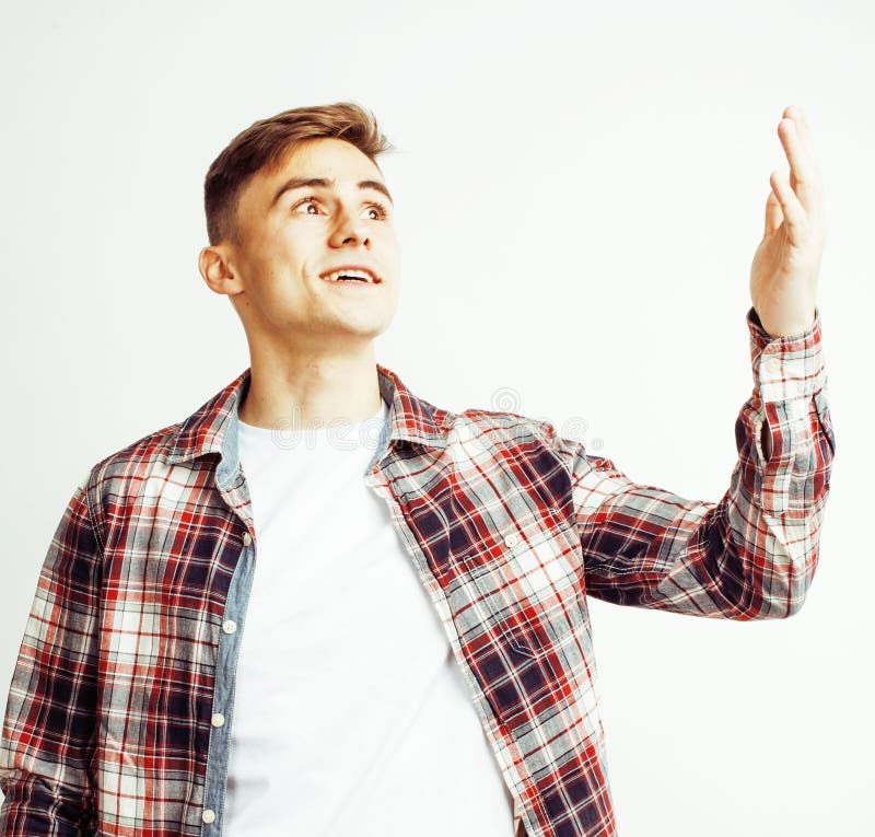 Young handsome teenage hipster guy posing emotional, happy smiling against white background isolated, lifestyle people concept close up. Young handsome teenage hipster guy posing emotional, happy smiling against white background isolated, lifestyle people concept close up