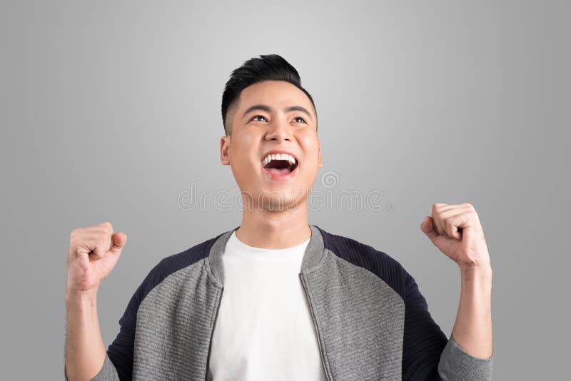 Giovane uomo bello felice che gesturing e che tiene il lookin aperto della bocca fotografia stock libera da diritti Giovane uomo bello felice che gesturing e che tiene il lookin aperto della bocca fotografia stock libera da diritti