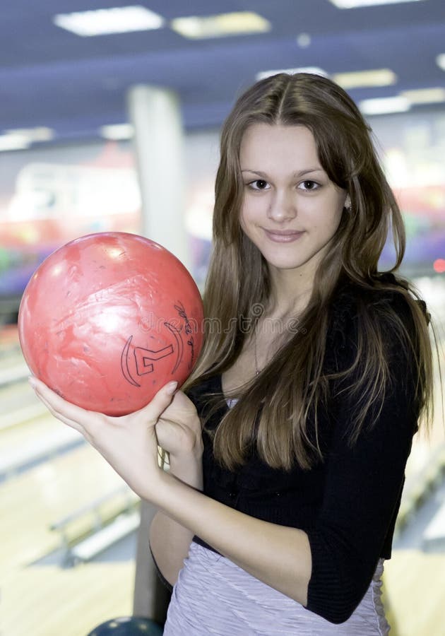 Girl with 10 pin bowling ball