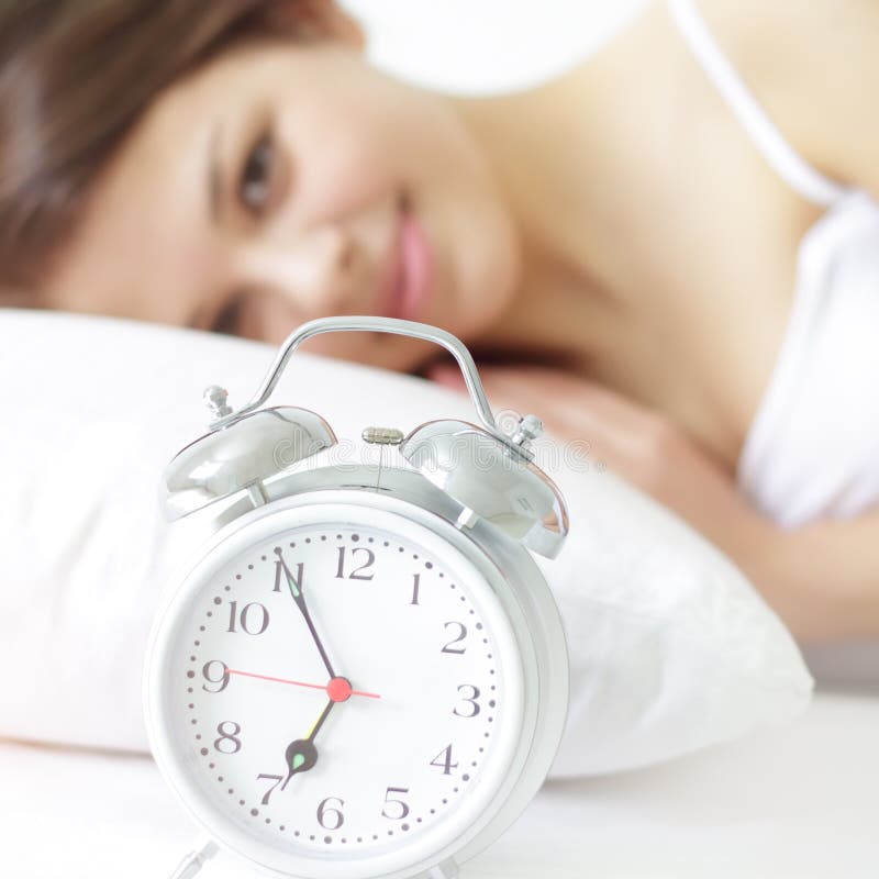 Amily Sleeping with Alarm Clock Near Their Heads Stock Photo Image of
