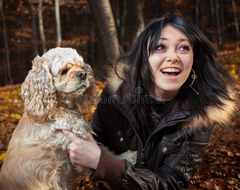 Girl and american cocker spaniel