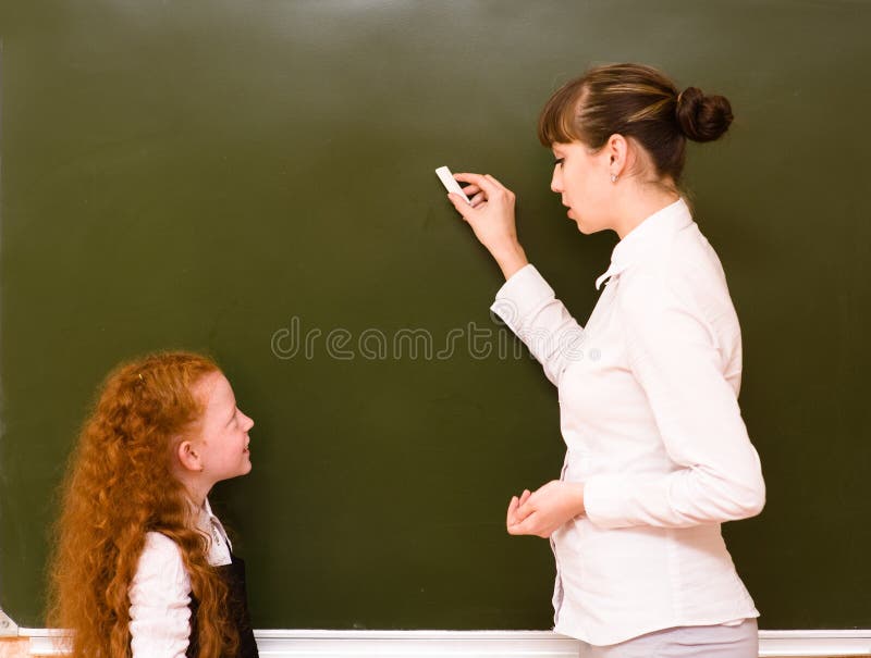 Girl answers questions of teachers near a school board