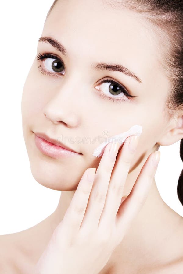 Girl Applying Moisturizer Cream On Face. Stock Photo Image of natural, freshness 19125528