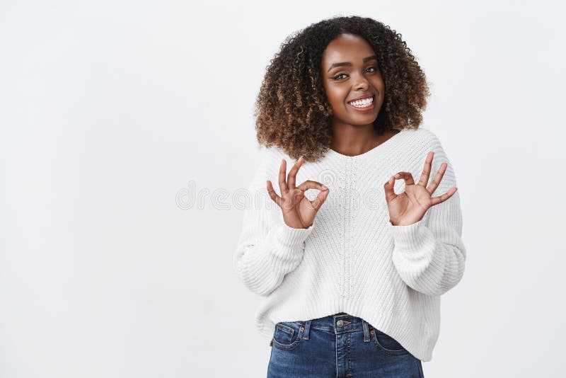 Girl assure customer everything done great show okay no problem ok gesture smiling friendly pleasant gaze camera agree stock image