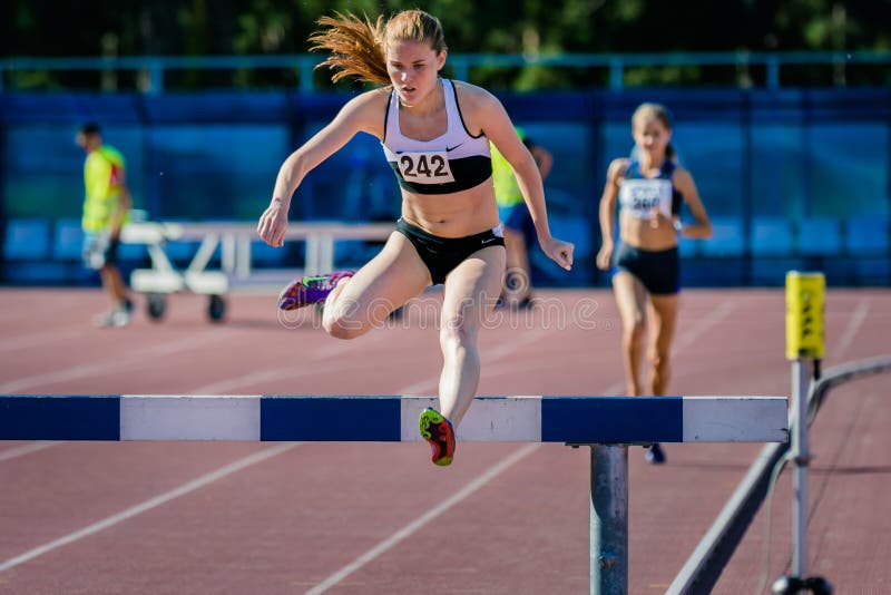 Girl athlete overcomes obstacles royalty free stock photo Girl athlete overcomes obstacles royalty free stock photo