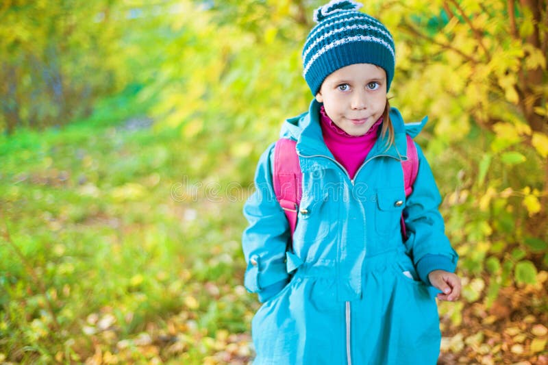 Girl in autumn forest stock photo