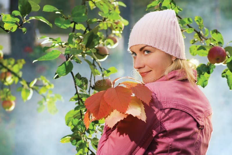 Girl with autumn leaves