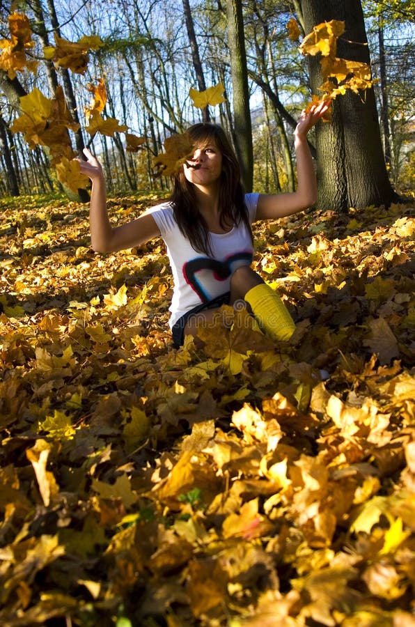 Girl with autumn leaves stock image. Image of blue, close - 7717059