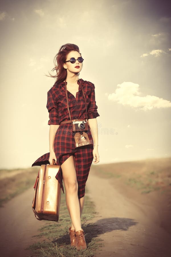 Girl with bag and retro camera