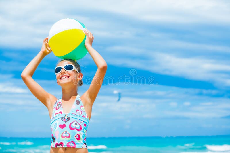 Girl with ball on the beach royalty free stock photo Girl with ball on the beach royalty free stock photo