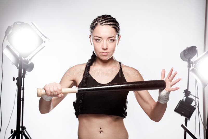 Girl with a baseball bat stock photo. Image of fighter 63855808