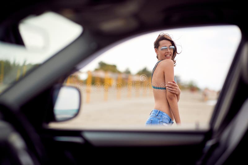 Girl On A Beach Teasing Through Car Window Stock Image Image Of