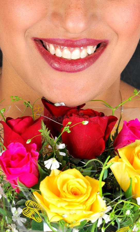 Girl with beautiful smile and roses