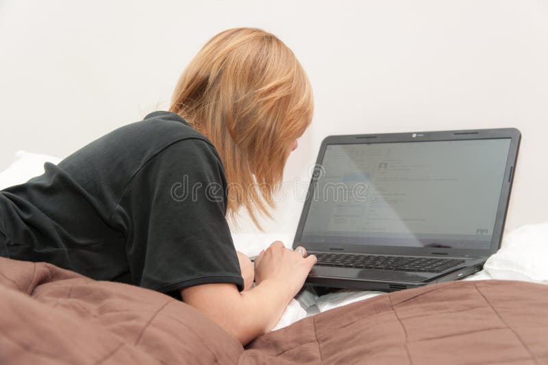 Girl in Bed with Laptop