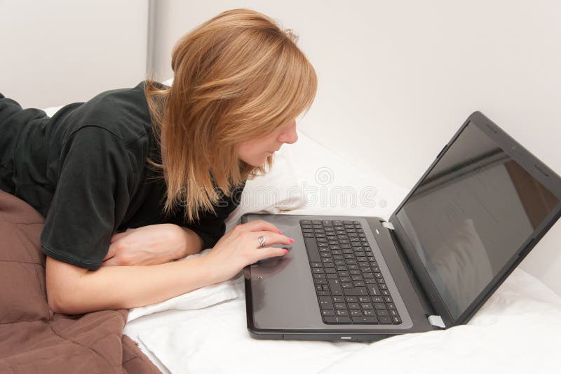 Girl in Bed with Laptop stock image. Image of notebook 35417527