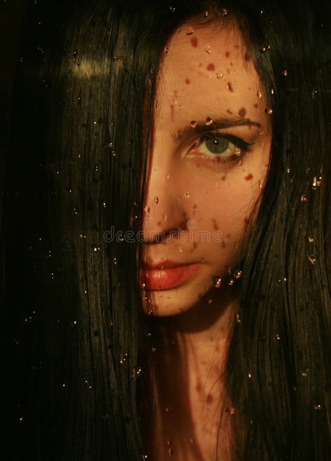 Girl behind the glass royalty free stock images