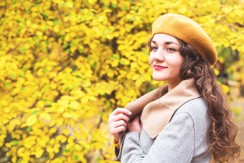 Girl in a Beret on a Background of Yellow Leaves. Stock Photo - Image ...