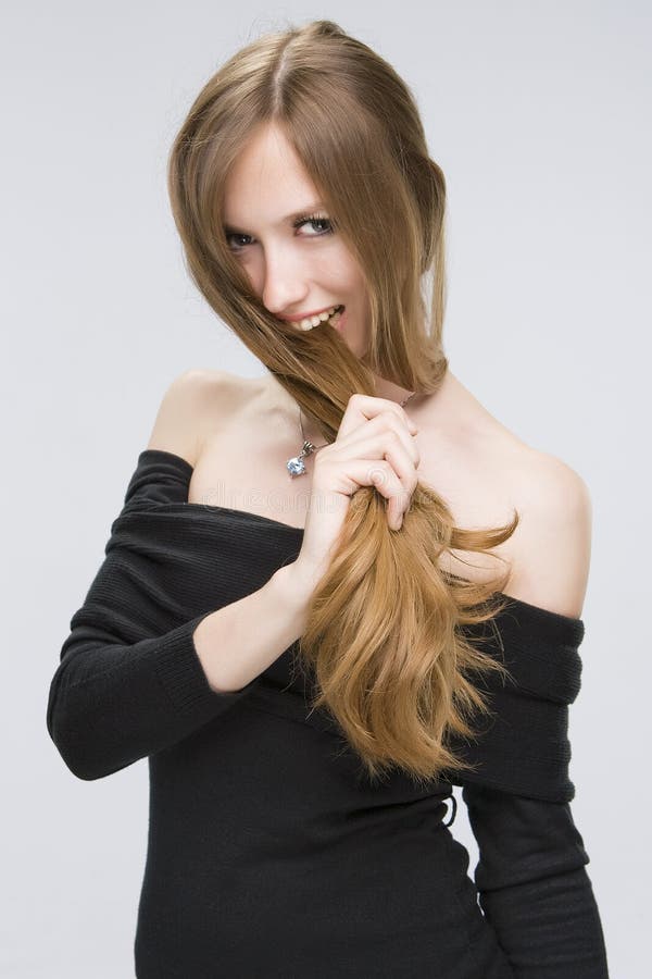 Girl biting her hair stock image. Image of brown, posing 11405021
