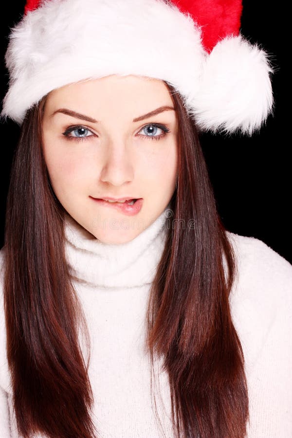 Girl Biting Her Lip Wearing Santa Hat Stock Photo - Image of father