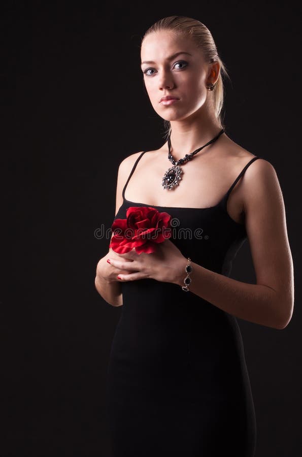 Girl in black dress with red rose