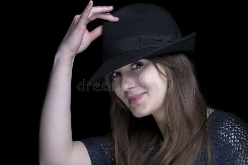 Girl in black with stylish black hat