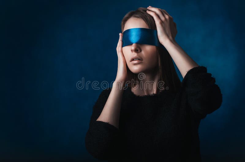 A Blindfolded Woman with Her Hands on Her Face · Free Stock Photo