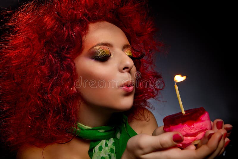 Girl blowing out candle stock photo. Image of bright 29293374