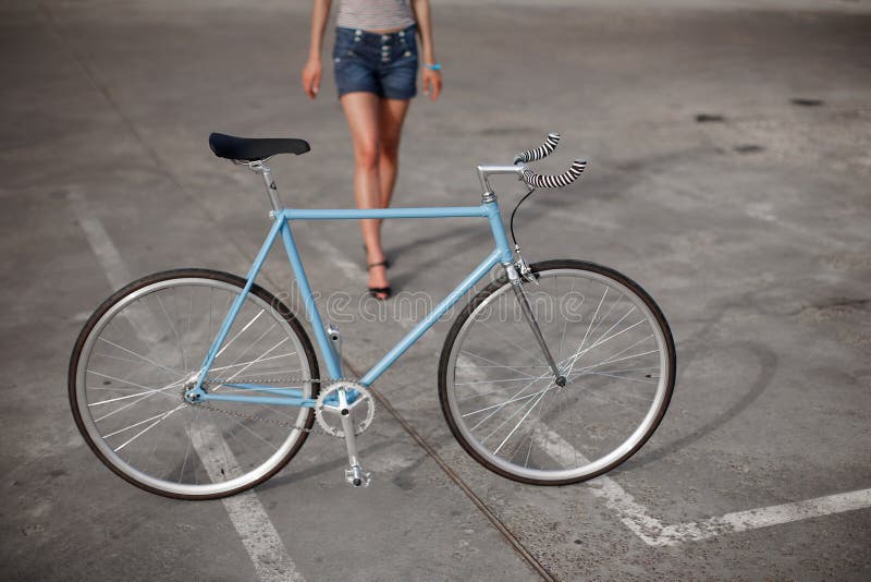 A girl with blue bike