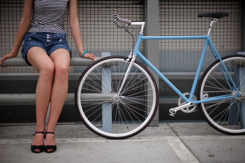 A girl with blue bike