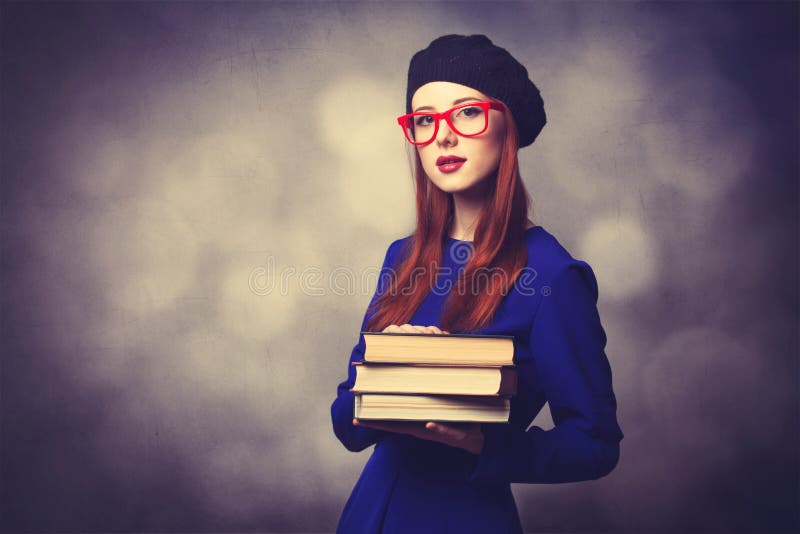 Girl in blue dress with books