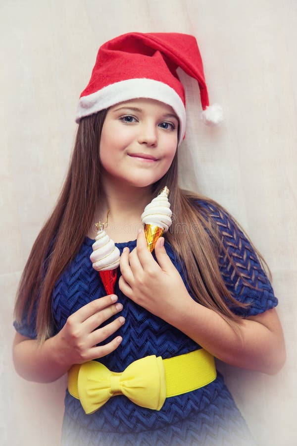 Girl In A Blue Elegant Dress With Christmas Toys In Her Hands Stock Image Image Of Blue