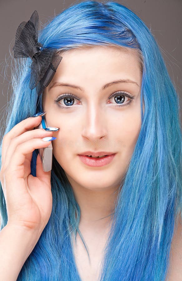 The girl with blue hair with a mobile phone