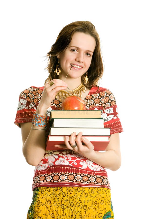 Girl with books and apple. Isolated on white.