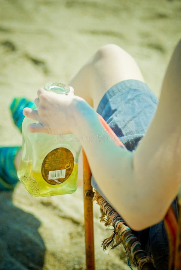 Girl with bottle on beach